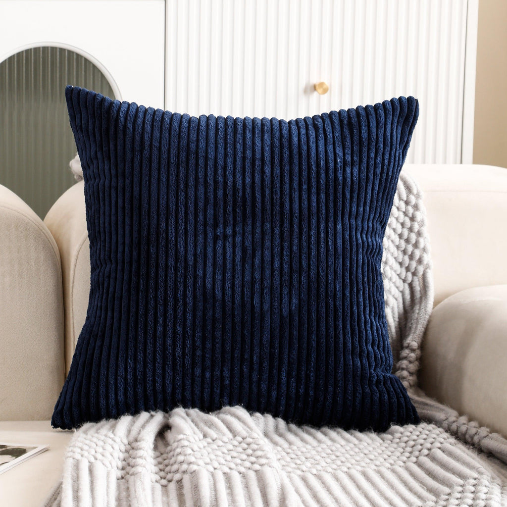 Square blue cushion cover made of soft corduroy fabric, showcasing a textured and cozy finish