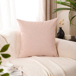 Load image into Gallery viewer, Burnt orange polyester cushion covers styled on neutral sofa
