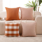 Load image into Gallery viewer, “Burnt orange cushion covers set of 4 with check and stripe designs on sofa
