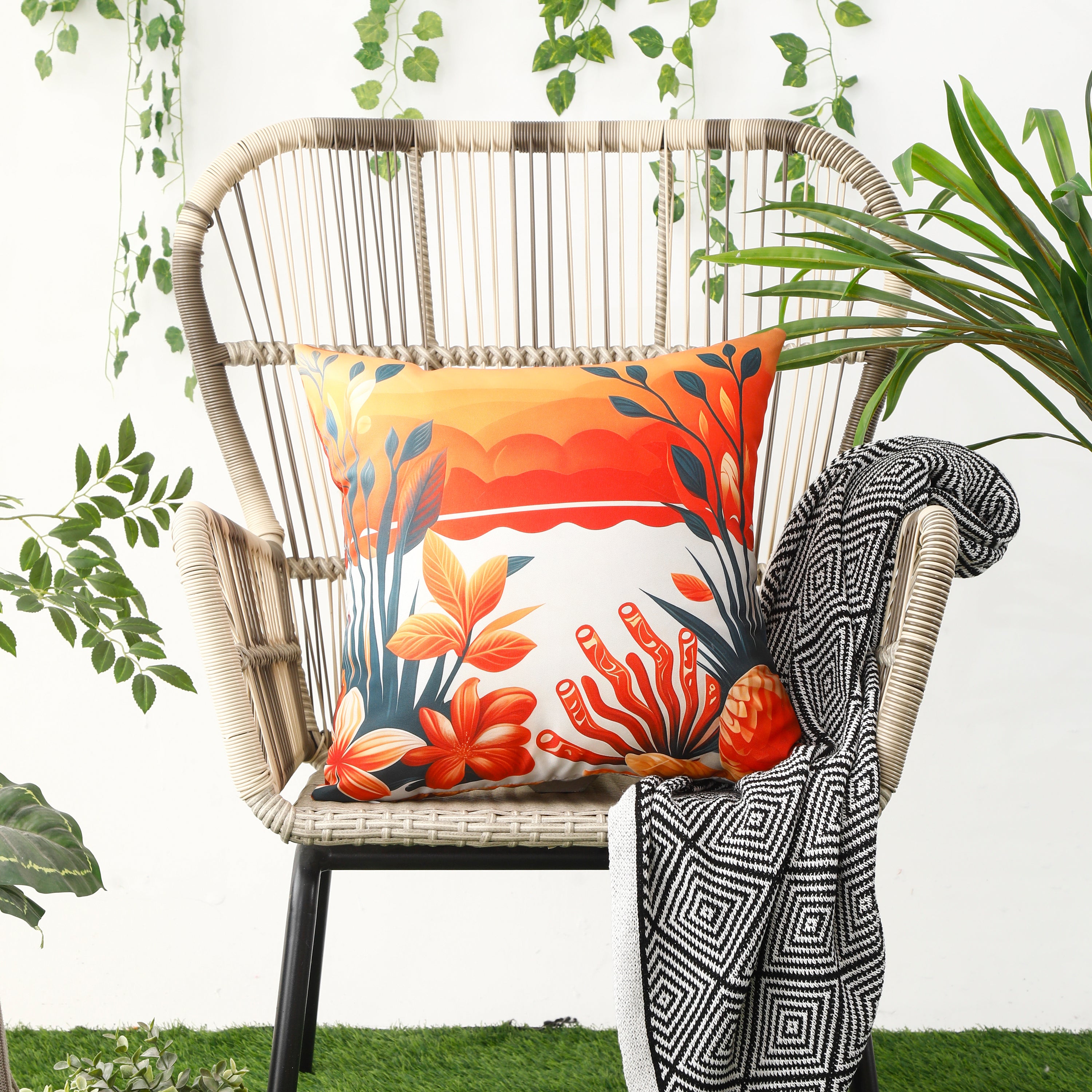 Waterproof cushion covers with seashell and starfish patterns displayed on a patio chair