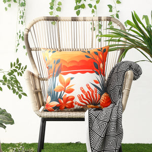 Waterproof cushion covers with seashell and starfish patterns displayed on a patio chair
