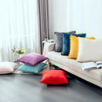 Load image into Gallery viewer, Velvet cushion cover with playful pom pom trim for modern home decor.
