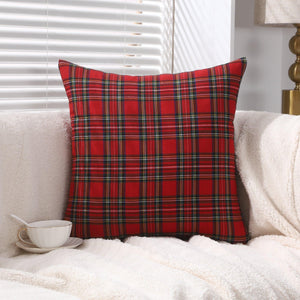 Classic red tartan check design cushion covers on a cozy sofa