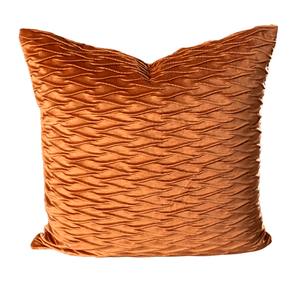 Close-up of orange scissors pattern on velvet cushion cover, ideal for sofa or bedroom decor